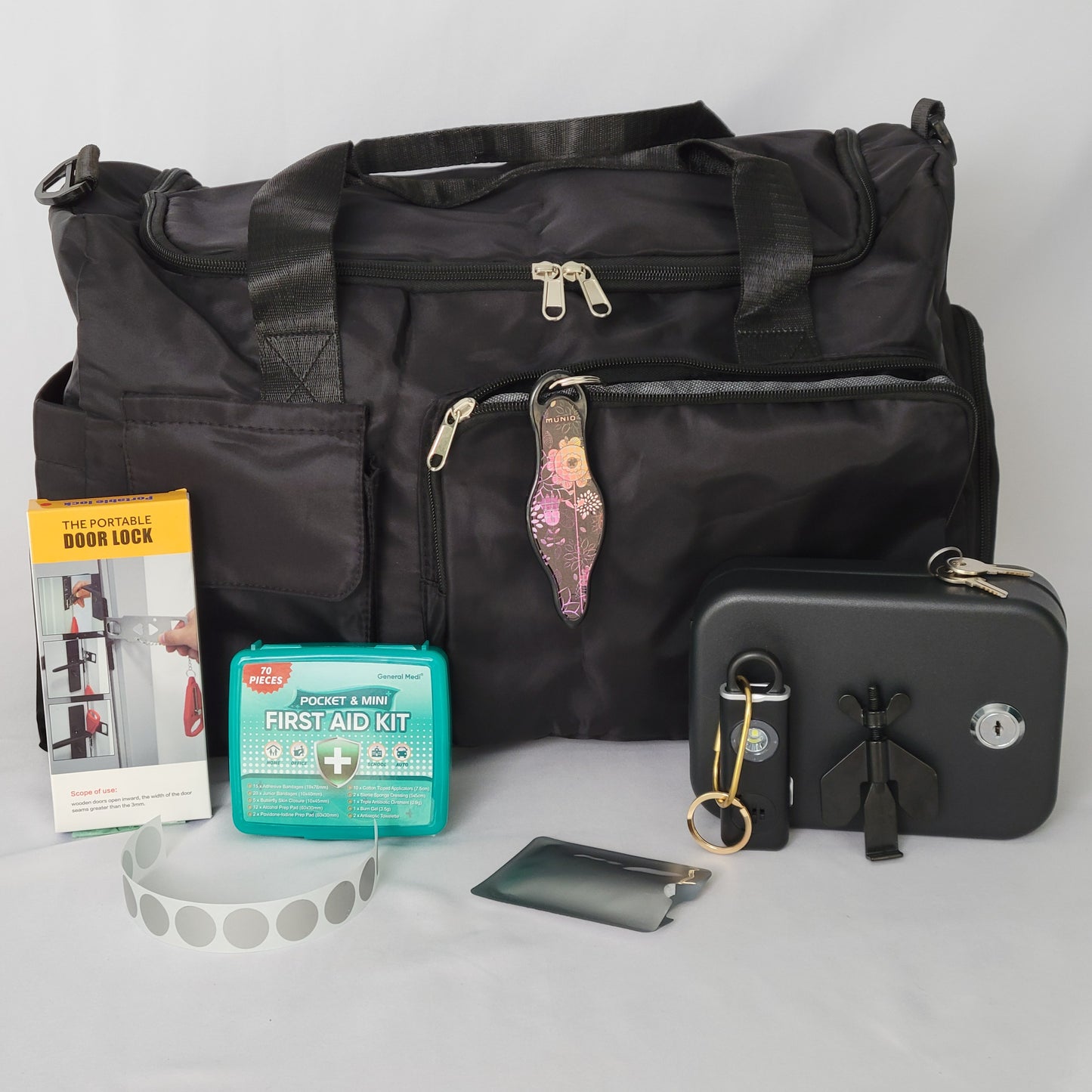 Women's Travel Safety Essentials Kit with a personal alarm, alarms and locks, and other key items for secure travels.